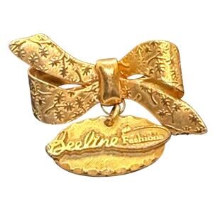 Beeline Fashions Gold Tone Bow Brooch Florentine Finish Dangling Logo Charm VTG